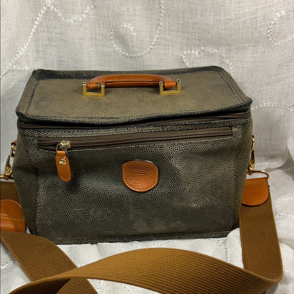 Bric’s travel toiletry leather bag with lock and key and removable strap